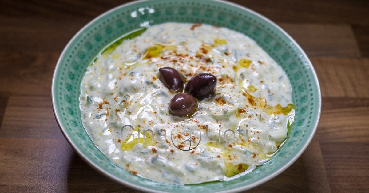 Tzatziki (yogurt & cucumber dip) topped with olive oil, olives & cayenne pepper